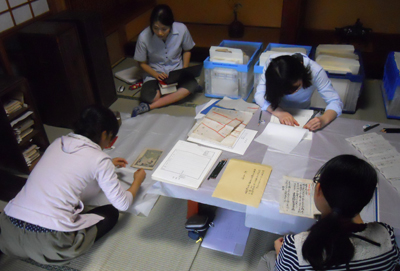 Surveying old manuscripts (photographed by the author in September 2013).