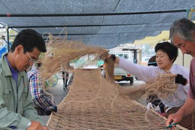 Couples working together on summer tasks, Shichigahama, Japan
