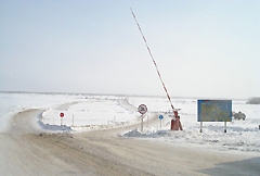 Winter road on the frozen ice over the Lena River in East Siberia